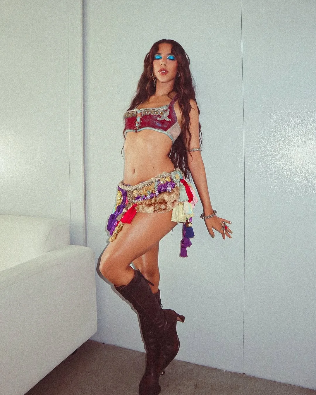 Photo by Marina Sena on February 17, 2026. May be an image of dancing, costume, headdress, miniskirt and text.